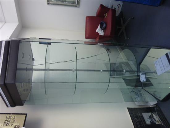 A large plate glass octagonal display case Height 6ft 10in. Width 1ft 6in.